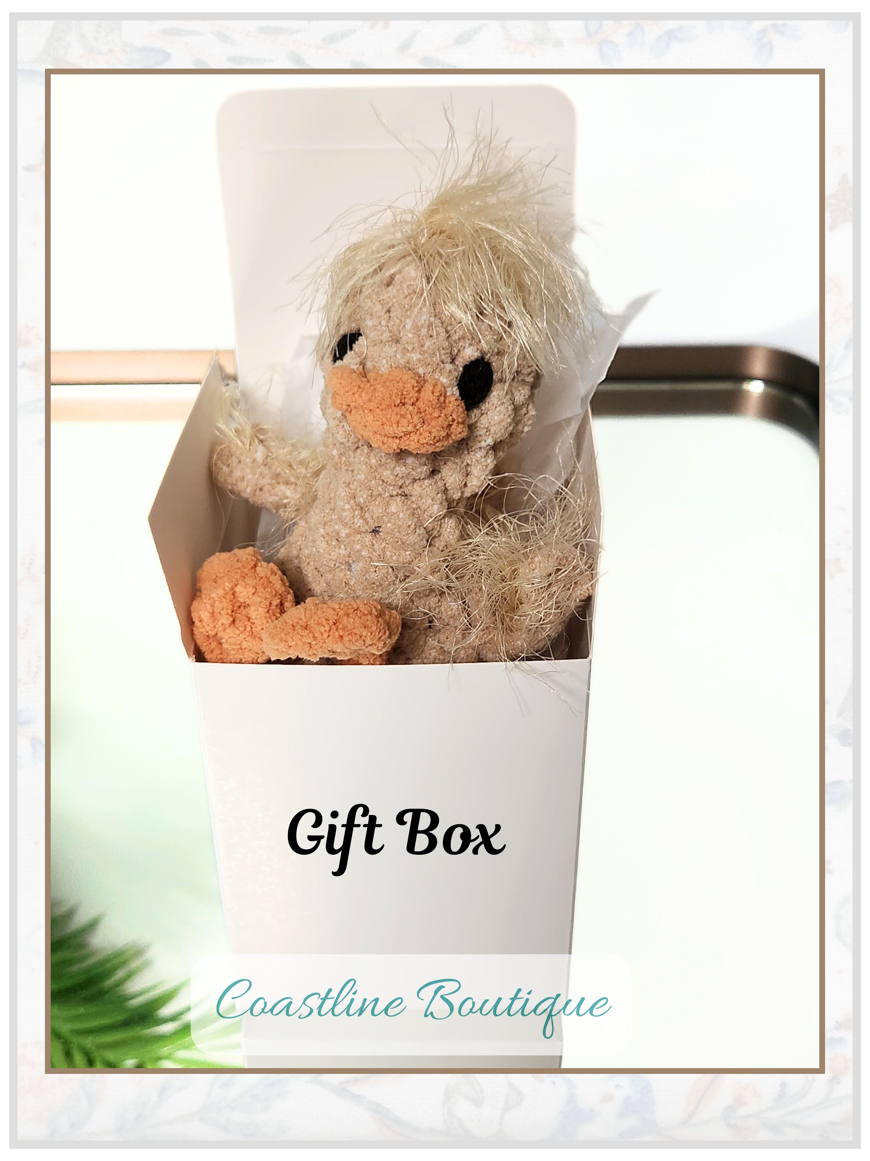The Brejoy Nugget Gosling crochet plushie nestled in a premium white gift box with artisan packaging, a signature handmade gift set by Coastline Boutique