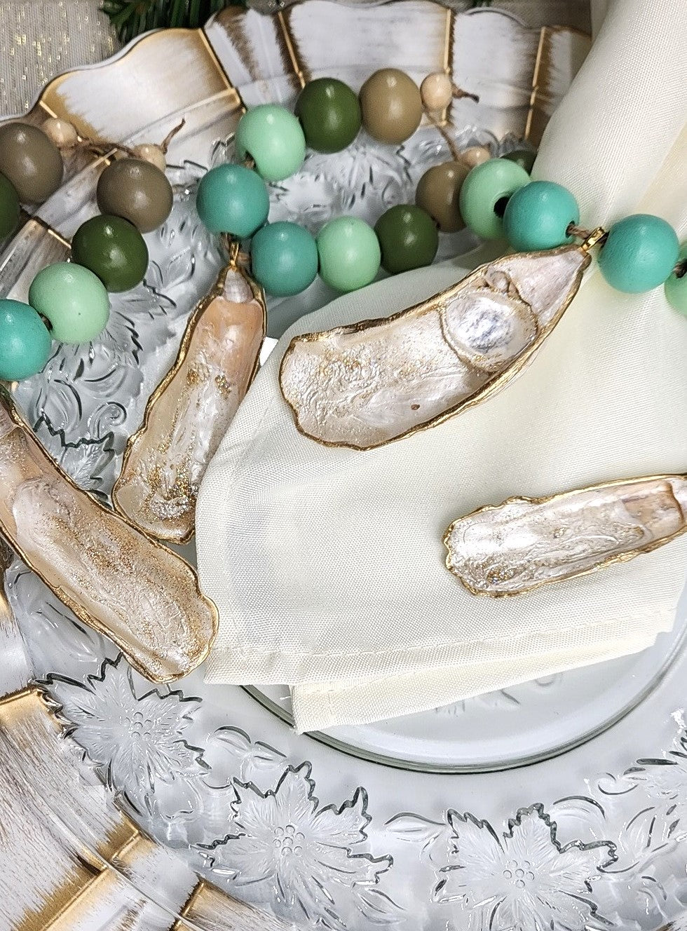 Oyster Shell Napkin Wood Bead Rings - Pearl White & Gold with Green Beads
