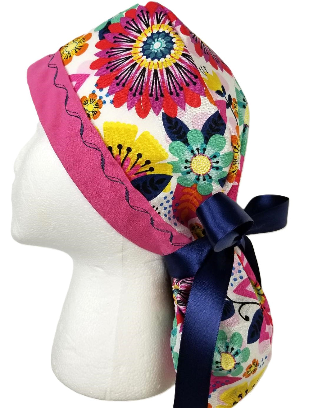 Vibrant multi-color floral surgical cap with a fuchsia designer-stitched headband by Coastline Boutique