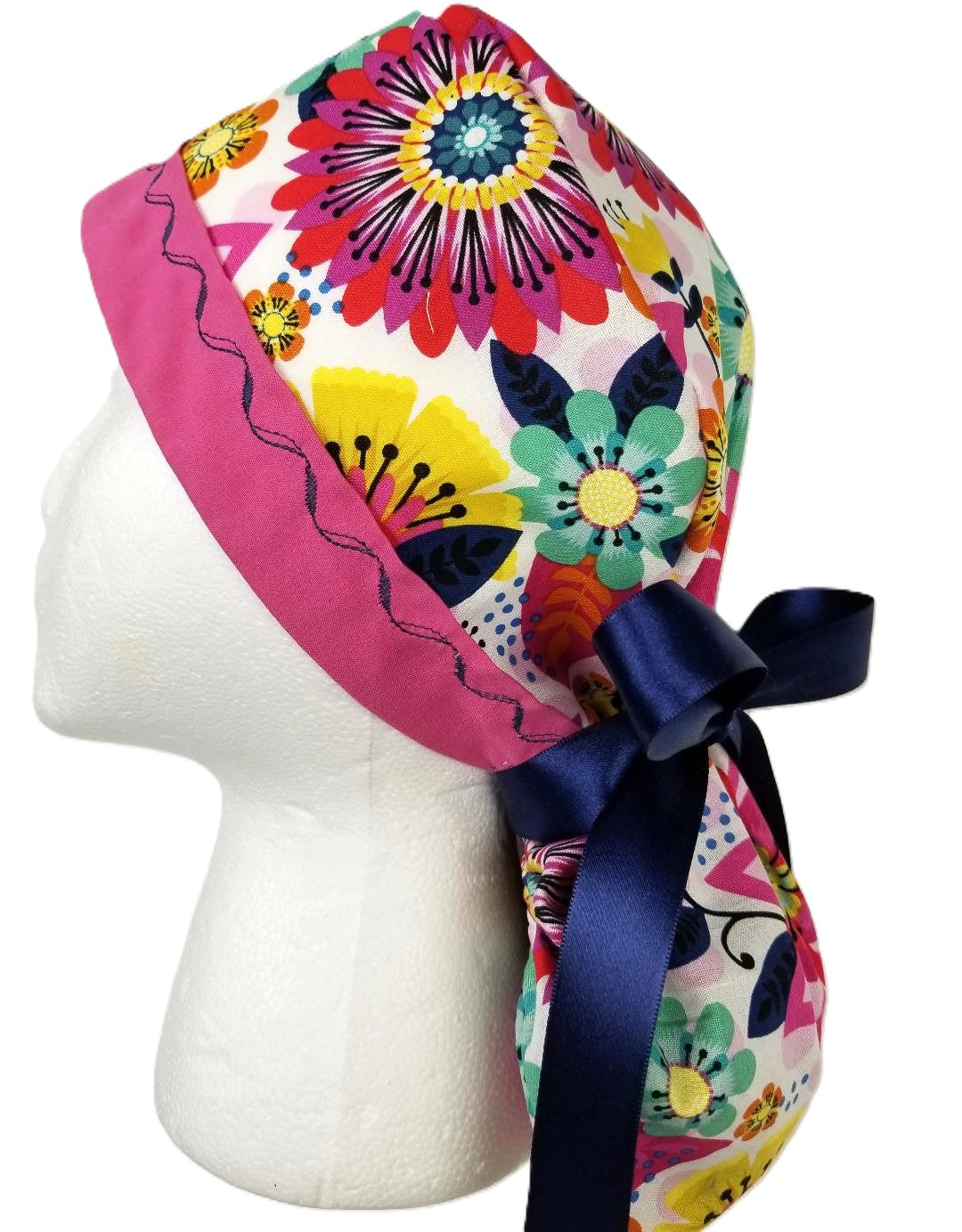 Vibrant multi-color floral surgical cap with a fuchsia designer-stitched headband by Coastline Boutique