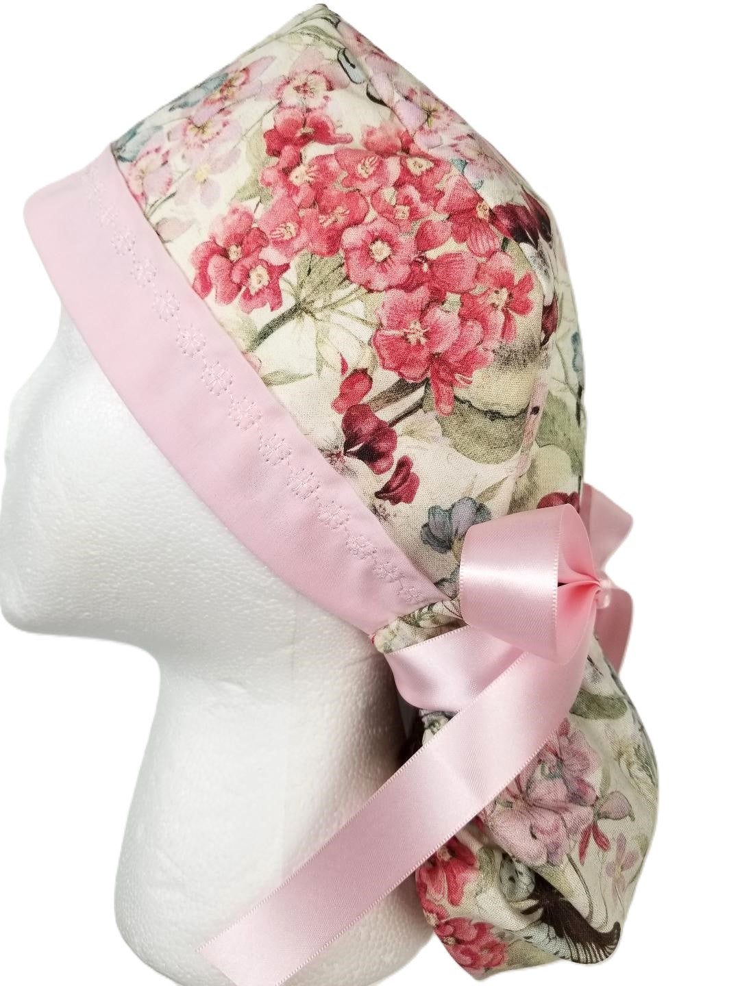 Airy butterfly meadow surgical cap with a petal pink headband and ivory designer stitching by Coastline Boutique