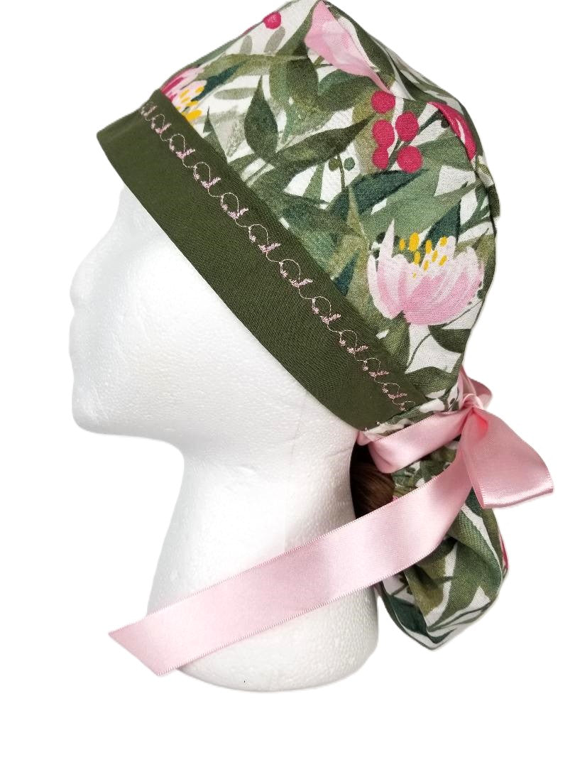 Olive green and pink floral ponytail surgical cap with a deep olive designer-stitched headband by Coastline Boutique