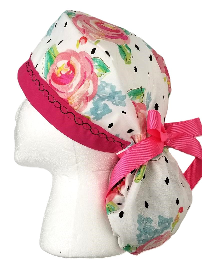 Watercolor Fusion floral surgical cap featuring vibrant fuchsia and pink blooms with modern black accents and a coordinating designer-stitched headband by Coastline Boutique